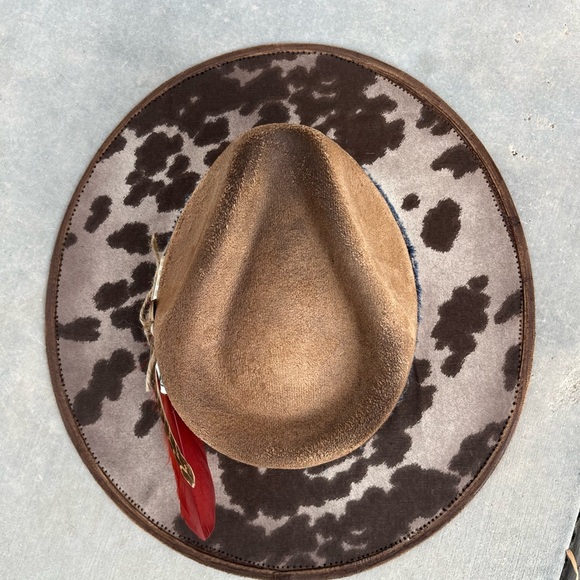 Brown cow print rancher style cowboy hat